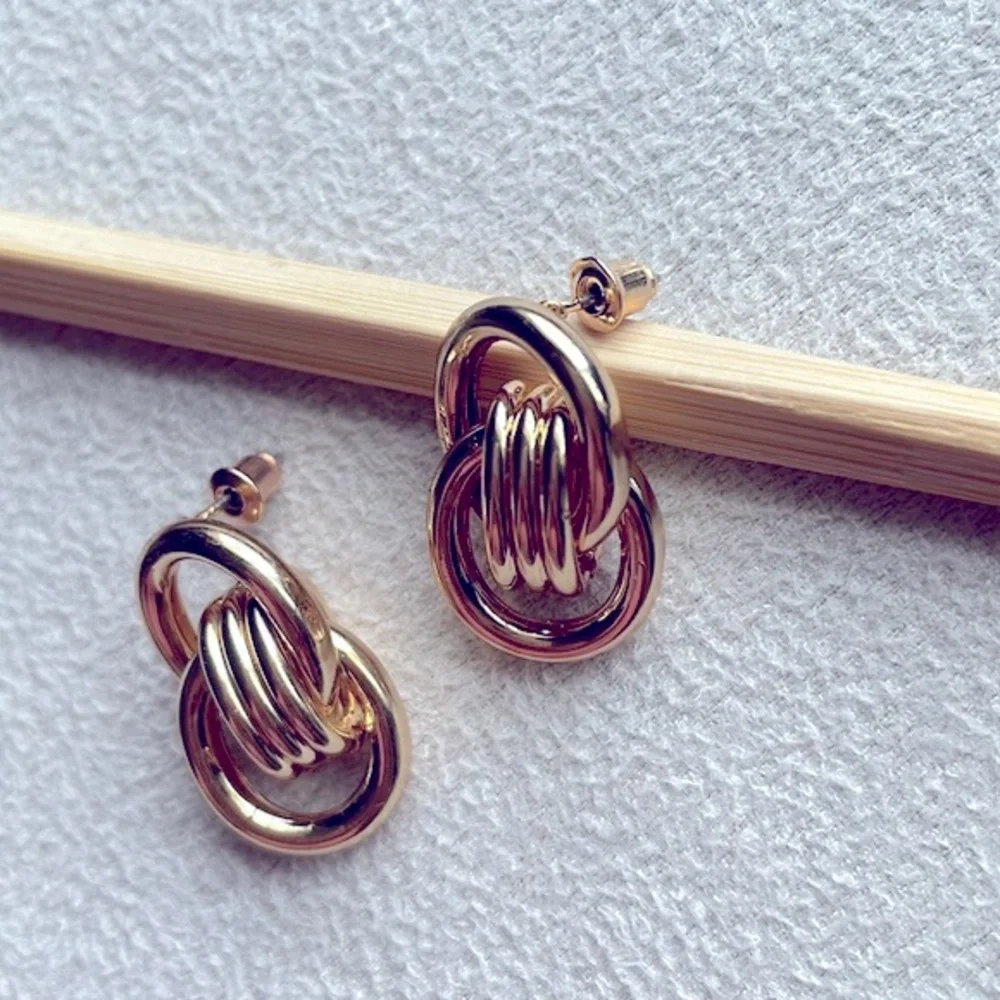 Gold double knot stud earrings